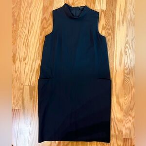Excellent condition. Size 4. Black wool mock neck shift dress with pockets.